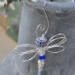 Dragonfly ornament styled in a calm outdoor space with natural light